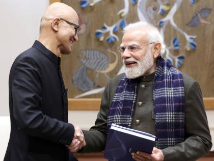 In this handout photo provided by Microsoft, CEO Satya Nadella, left, shakes hands with Indian Prime Minister Narendra Modi during their meeting in New Delhi, India, on Tuesday, December 9, 2025.