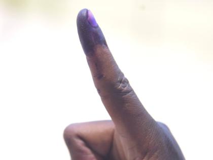 
A voter shows off his inked finger after voting in the general elections on September 3, 2025.