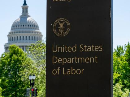 In this May 7, 2020 file photo, the entrance to the Labor Department is seen near the Capitol in Washington. 