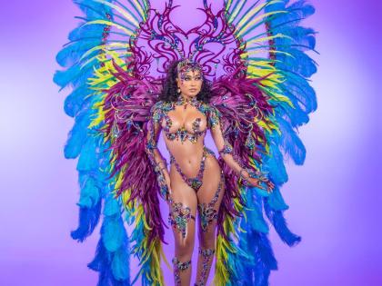 Centre: Designed by Shawn Dhanraj and inspired by the elements and the celestial phenomenon of the Northern Lights, Aurora is defined by radiant colour, expansive feather work and fluid movement. 