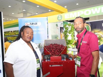 Inventors Allison and Oral Turner with their Sorrel Deeseeder. 