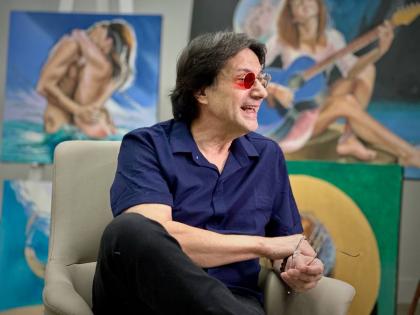 Fernando Dávila, a colour-blind painter, speaks during an interview with The Associated Press at his gallery in Doral, Florida.