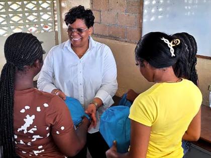 Dr Marsha Smith, with a few of the young adults following the Bahali Hurricane Melissa Recovery Project hosted by the Newell High School in St Elizabeth.