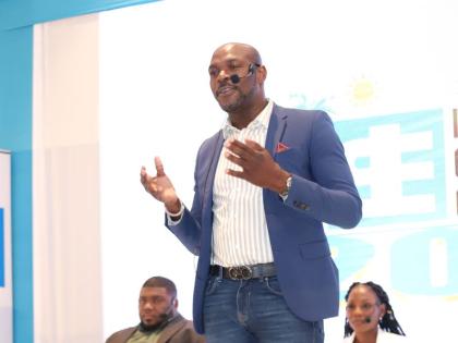 Sygnus Group CEO Berisford Grey addresses the JSE Capital Markets Conference on its final day, January 26, 2023. In the background are Simon Johnson and Simone Hudson, both of Stratus Alternative Funds SCC.