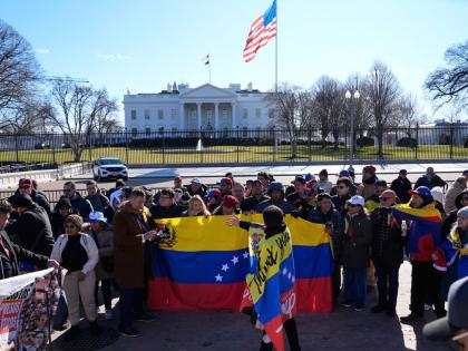AP 
People rally as Venezuelan opposition leader María Corina Machado meets with President Donald Trump at the White House on January 15 in Washington DC. 