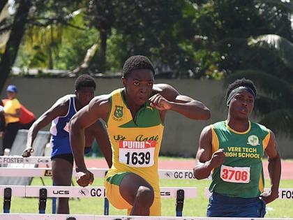 Ian Allen Marquese Page (left) of St Jago High wins the Class Two boys’ 110m hurdles event at the Central Hurdles, Relays and Field Events meet in 13.67 seconds at G.C. Foster College last Saturday.  Jhabarie Whyte (right) of Vere Technical was third in 