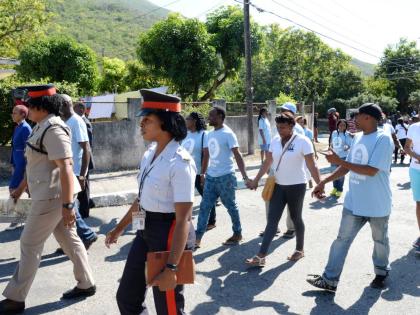 Members of the Jamaica Constabulary Force among persons participating in a Peace march in August on Monday January 16, 2017.