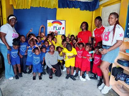Students and staff at Kingdom Builders in Spanish Town pose for a photograph after Play Day activities on Wednesday.