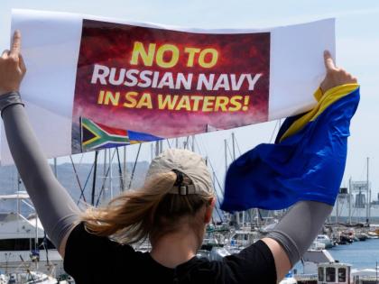 A protester demonstrates against Russia’s naval presence in Simon’s Town Harbour in Cape Town, South Africa, Friday, Jan. 9, 2026. 