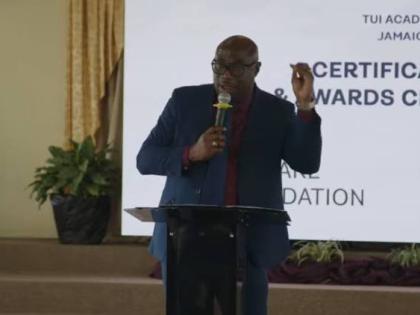 Dr Darien Henry, the principal of Montego Bay Community College, addressing the Institute of Vocational Education and Skills Training Limited’s [INVEST] graduation ceremony at the Mt Salem Seventh-day Adventist Church in Montego Bay, St James, on Wednesd