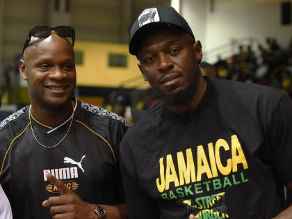 
Track and field legends Asafa Powell (left) and Usain Bolt made it their point of duty to support Jamaica’s push for a place at the FIBA World Cup during a qualifier against the Bahamas at the National Indoor Sports Centre on Thursday.
