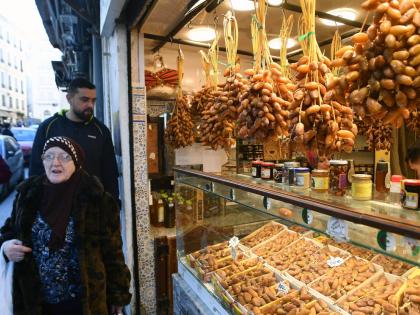 People stock up on food at a market in Algiers, Algeria, before the start of the holy month of Ramadan. 