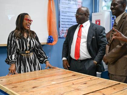 Permanent Secretary in the Ministry of Education, Skills, Youth and Information, Dr Kasan Troupe (left), shares a moment with Principal, St Mary Technical High School, Orville Richards (centre), and Board Chairman, St Mary Technical High School, Dr Isaac B
