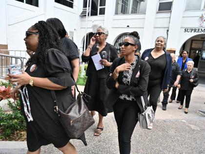 Family members and friends of Melissa Silvera leave the Supreme Court after the sentencing of Jolyan Silvera at the Supreme Court in downtown Kingston yesterday. 