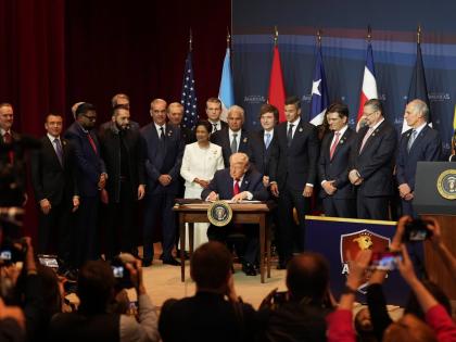 President Donald Trump signs a proclamation committing to countering cartel criminal activity at the Shield of the Americas Summit, Saturday, March 7, 2026, at Trump National Doral Miami in Doral, Florida. (AP Photo/Rebecca Blackwell)
