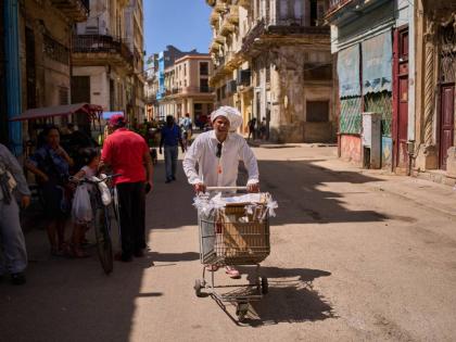 A baker selling baked goods in the streets of Havana, Cuba.