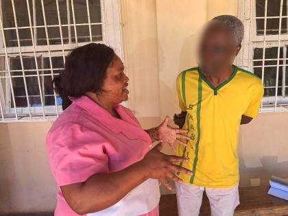 Quadisha Lee, patient care assistant, speaks wth Dempson.