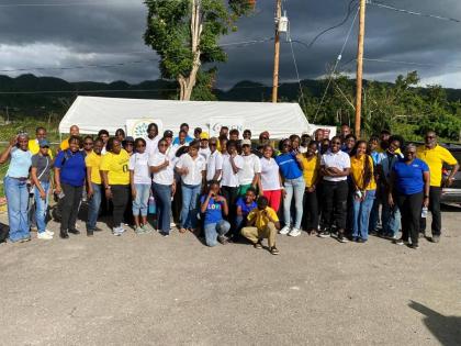 Volunteers with the NorthGate Youth and Family Development Foundation’s Operation GRACE initiative in Cambridge, St James, pose together for a group shot outside the Cambridge Health Centre in the community on March 7, during the official start of Operat