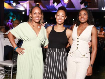 From left: Toni-Ann Neita-Elliott, vice-president of sales and marketing at Sterling Asset Management, and her sister Stephanie Koathes, pause for a quick photo with Shanique Williamson, manager, personal financial planning at Sterling Asset Management.