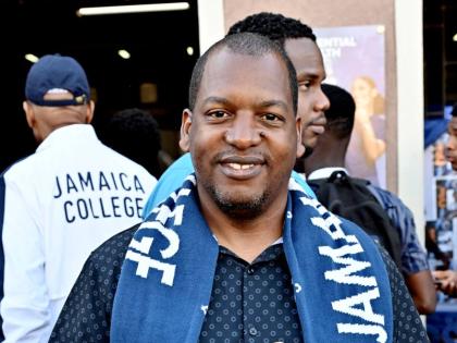 Duane Johnson, head coach for the Jamaica College track and field team, during the celebrations at the school’s campus on Monday for winning the boys’ title at Champs, 
