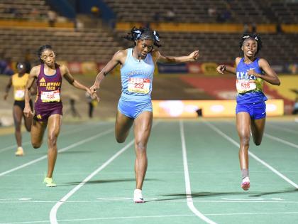 Ian Allen/Photographer 
Edwin Allen High School’s Kellyann Carr (centre) wins the Girls’ Class One 400 metres ahead of Hydel’s Nastassia Fletcher (right) and Holmwood Technical’s Abrina Wright at the ISSA/GraceKennedy Boys and Girls’ Athletics Ch