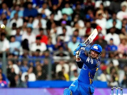 Mumbai Indians’ Quinton de Kock hits a boundary during the Indian Premier League cricket match against Punjab Kings in Mumbai, India, yesterday.