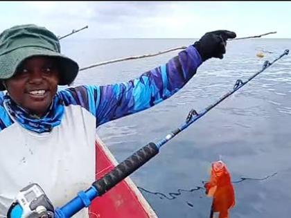 Female fisher Sashae Shaw catches fish on the high seas in Portland recently. 