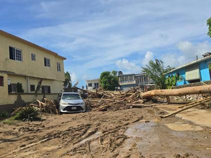 Thick mud blocks the entrances to homes in Westgreen, Montego Bay, St James, following the passage of Hurricane Melissa. 