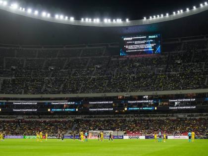 Referee Walter Lopez suspends a Concacaf Champions Cup quarter-final second leg football match between Mexico’s America and the United States’ Nashville SC in Mexico City on Tuesday, April 14, 2026. The suspension happened on account of discriminatory 