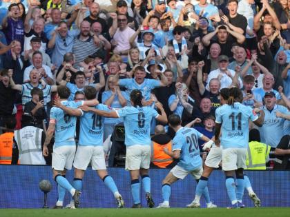 
Manchester City players celebrate after scoring during the FA Cup semi-final football match against Southampton in Manchester, England, yesterday.