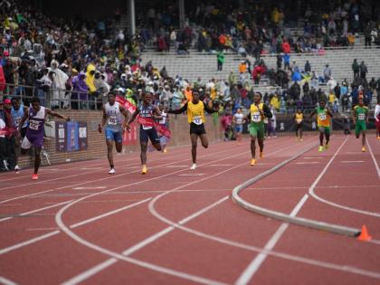 
Jamaica College’s Kai Kelly (third left) anchors his team to victory in the boys’ Championships of America 4x100-metre relay at the Penn Relays inside the Franklin Field Stadium in Pennsylvania yesterday. 