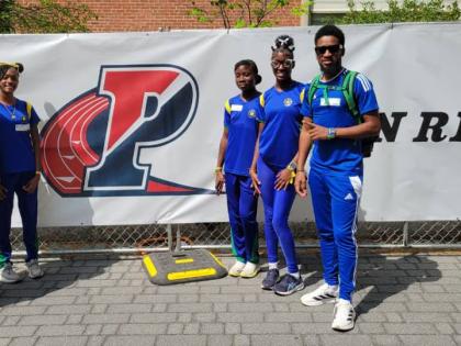Meadowbrook coach Dino Rochester (right) and his quartet at the Penn Relays.