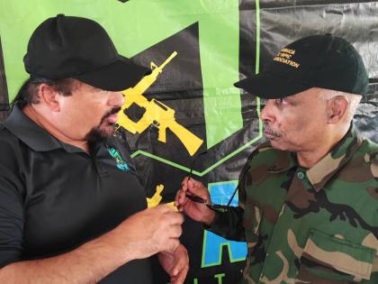 Christopher Samuda (right), president, Jamaica Olympic Association (JOA), listens intently as Dr Jason McKay outlines plans for the McKay Security St Mary FA Major League at the competition’s launch and opening games on Sunday at the Westmoreland Oval in