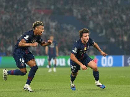 Paris Saint-Germain’s Joao Neves (right) celebrates after scoring his side’s second goal during a Champions League semi-final, first leg, football match against Bayern Munich in Paris yesterday. PSG won 5-4.