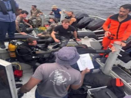 Divers resting after searching for survivors of the MV Barima tragedy in Guyana.
