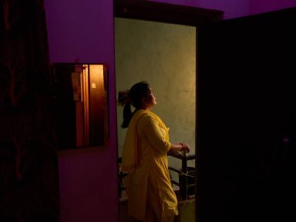 Bharati Thapa, a former HIV outreach worker who turned to sex work to survive after losing her job amid the US foreign aid cuts, poses for a portrait outside the office of her former NGO.