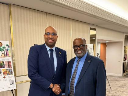 Delano Seiveright, Jamaica’s minister of state in the Ministry of Industry, Investment and Commerce, and Dr Andy Ingraham, founder, president and chief executive officer of the National Association of Black Hotel Owners, Operators and Developers, during 