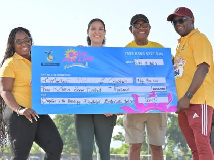 JEP Group President and CEO Dr Wayne McKenzie (left) and Senior Marketing Officer Moya Mullings (right) present a $4.7-million cheque to Bustamante Hospital for Children CEO Anthony Wood (second right) and Dr Kayla Spencer.