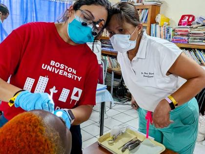 Health professionals examine a patient’s eyes during a Zion Care International medical outreach.