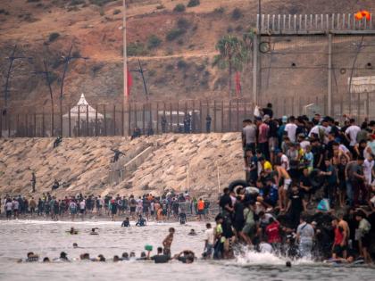 Migrants return to Morocco from the Spanish enclave of Ceuta, on Friday. - AP photo