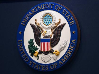 FILE - The State Department seal is seen on the briefing room lectern at the State Department in Washington, Jan. 31, 2022. (Mandel Ngan, Pool via AP, File)