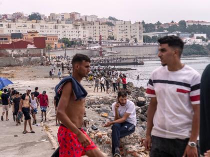 Migrants return to Morocco from the Spanish enclave of Ceuta.