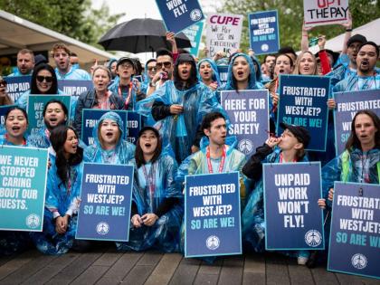 WestJet flight attendants strike at Vancouver International Airport in Richmond, British Columbia, Sunday, Aug. 2, 2026. (Ethan Cairns/The Canadian Press via AP)