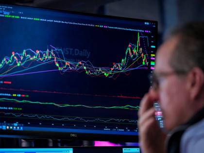 A trader works on the floor of the New York Stock Exchange, Thursday, July 30, 2026, in New York. (AP Photo/Yuki Iwamura)