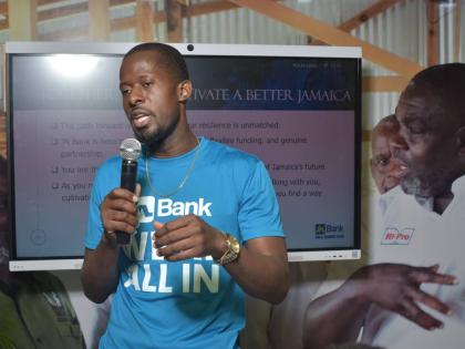 Janordo Patterson, credit solutions manager in JN Bank’s Business Banking Division, addresses patrons at the recent Denbigh Agricultural, Industrial and Food Show in Clarendon about JN Bank’s business solutions. 
