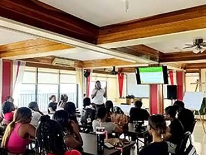 Shauna Todd, project liaison/coordinator at the Institute of Law and Economics, delivers a presentation on financial literacy.
