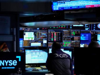 Specialist Dilip Patel works on the floor of the New York Stock Exchange, Thursday, July 30, 2026, in New York. (AP Photo/Yuki Iwamura)