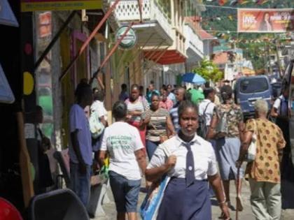 People walking along a street in Dominica.