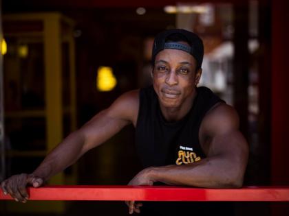 Shaka Smith, a vegan influencer who's politically an independent, poses for a portrait at his fast-food restaurant in Santa Monica, Calif., Thursday, Aug. 6, 2026. (AP Photo/Jae C. Hong)