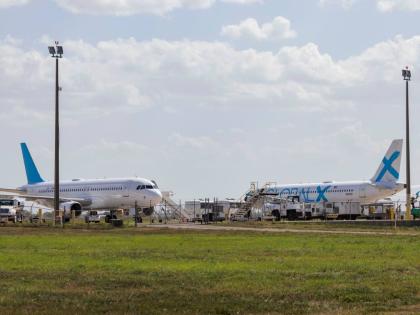 Planes used for deportation flights sit at the Valley International Airport, in Harlingen, Texas.